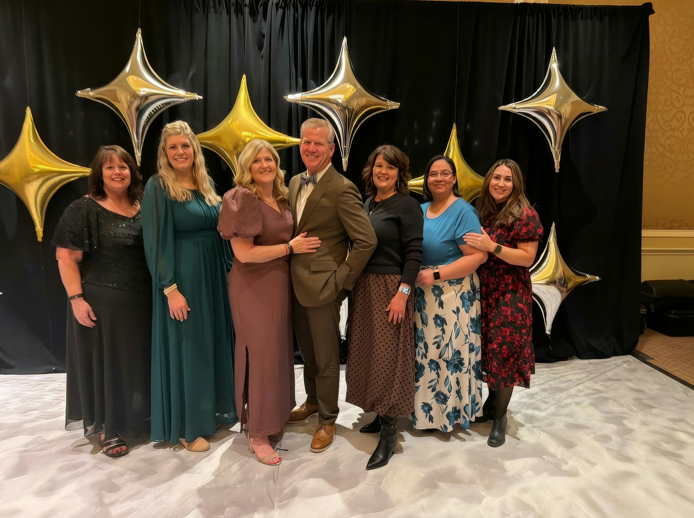 Dr. Tanner and staff standing in their office