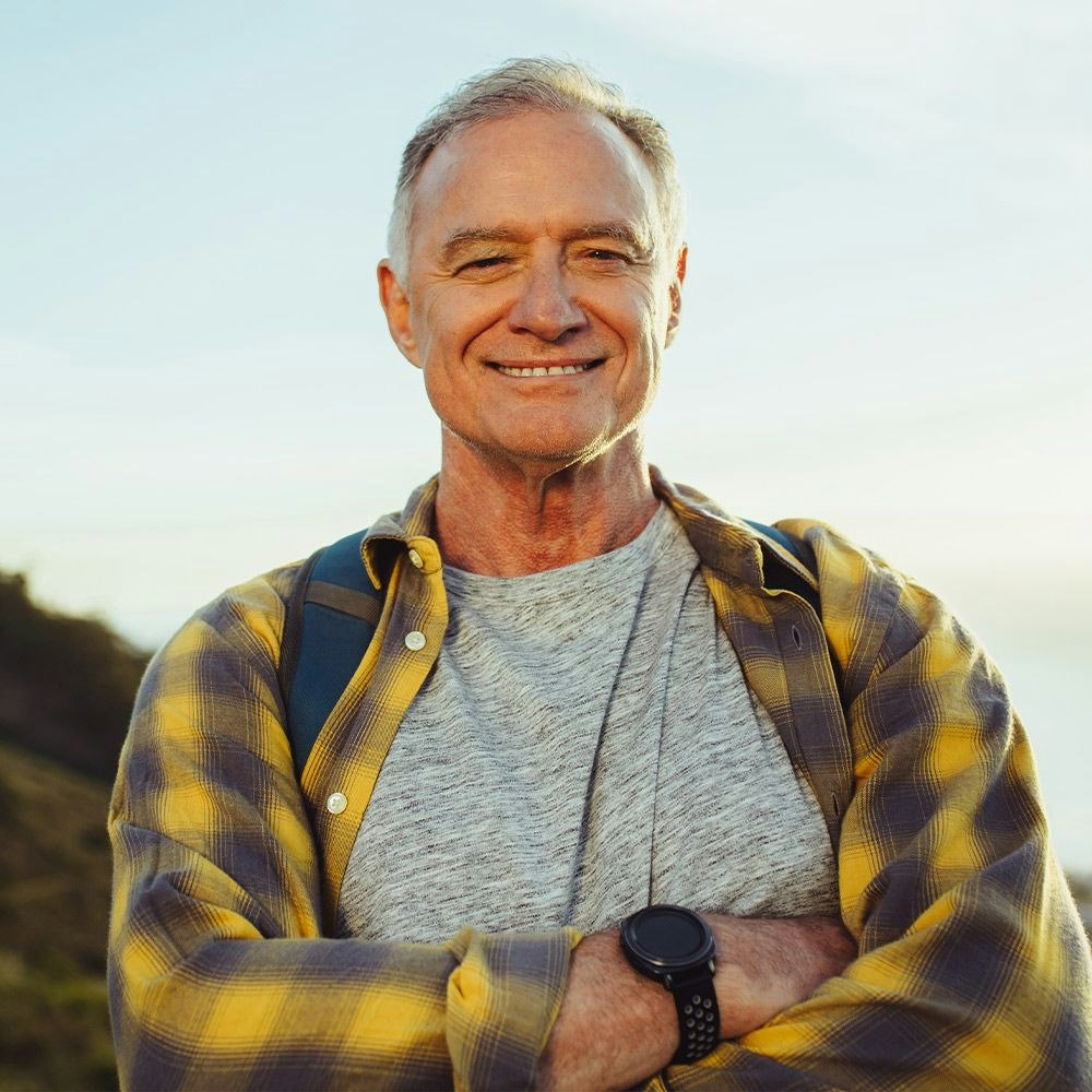 Smiling older man in plaid shirt