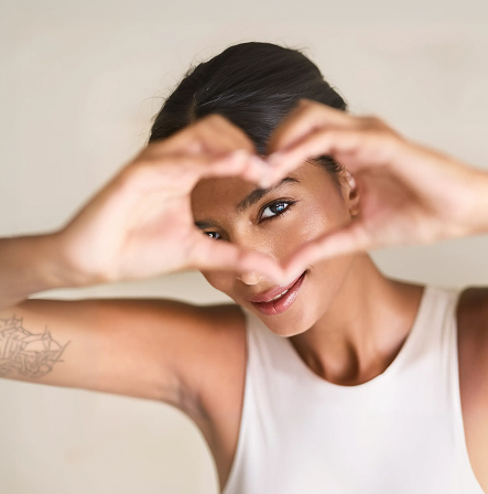 woman making heart with hands