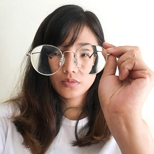 woman holding glasses