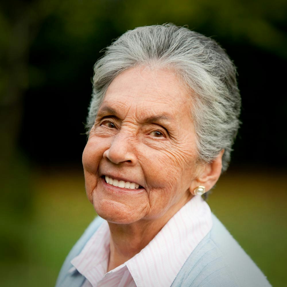 Smiling mature woman with dental implants