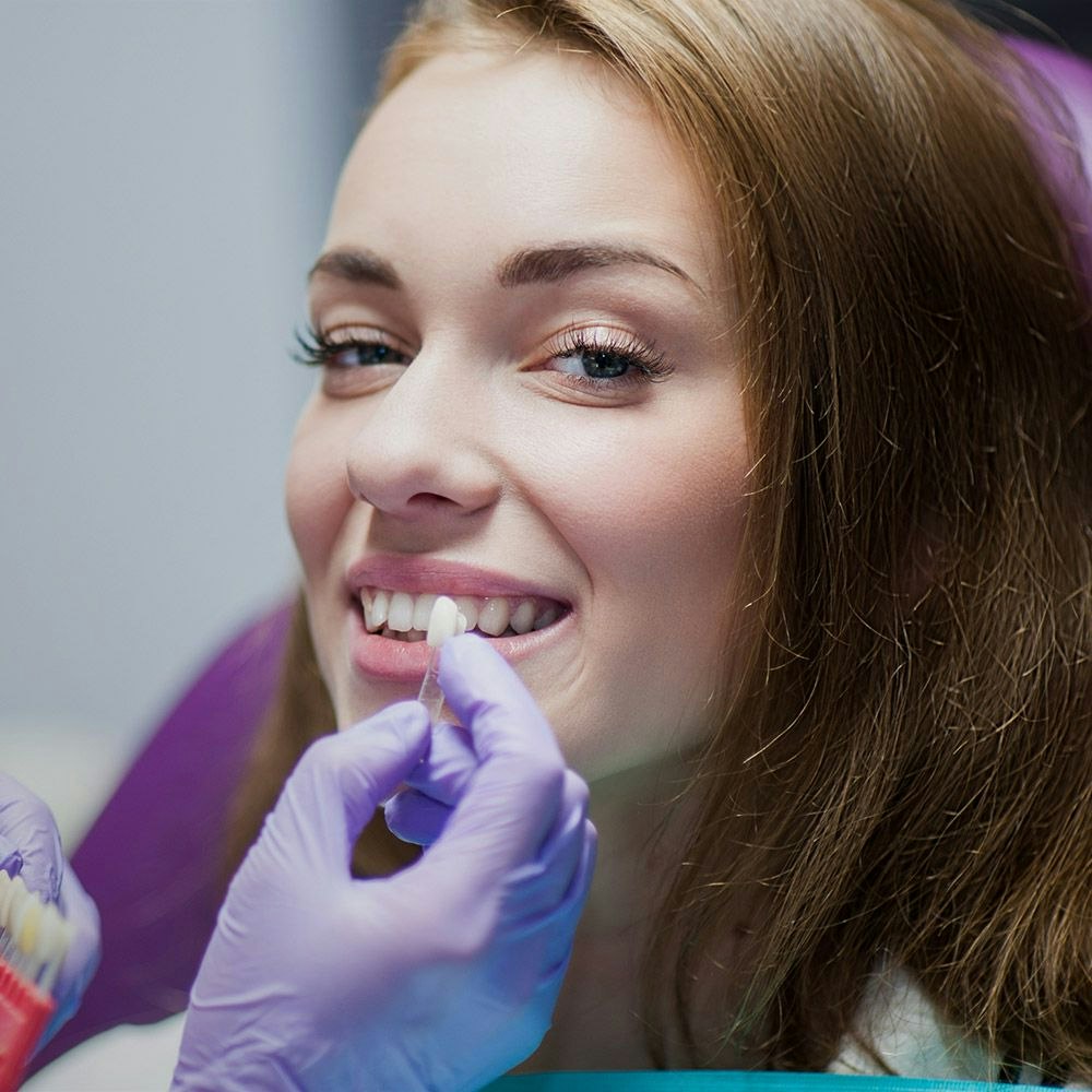 woman getting color matching for her crown