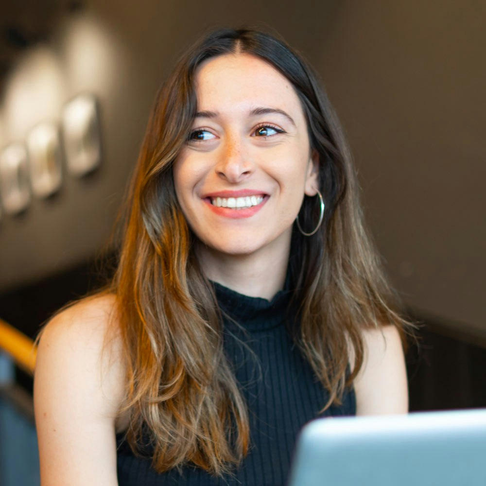 Smiling woman on laptop