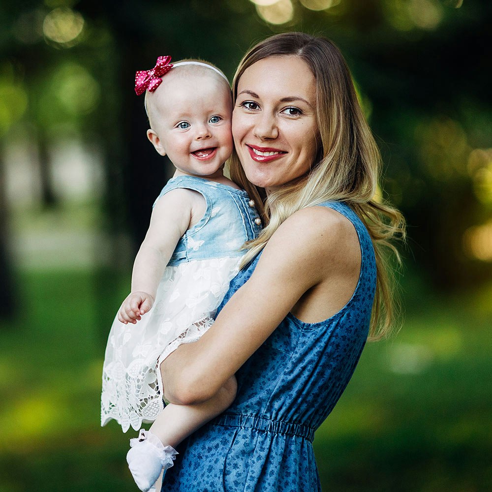 Young mother holding baby