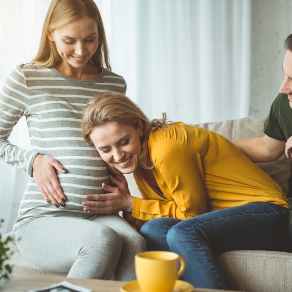 Woman and surrogate smiling