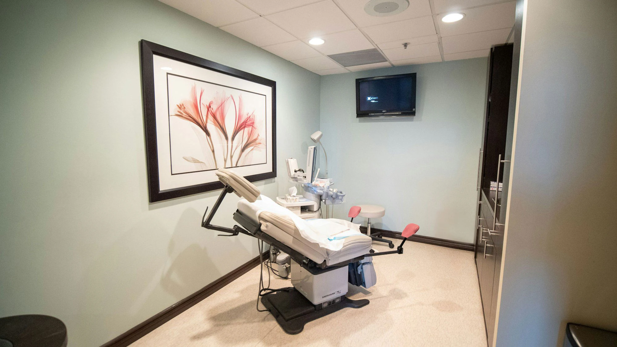 Examination room at The Center for Fertility and Gynecology with exam table and medical equipment