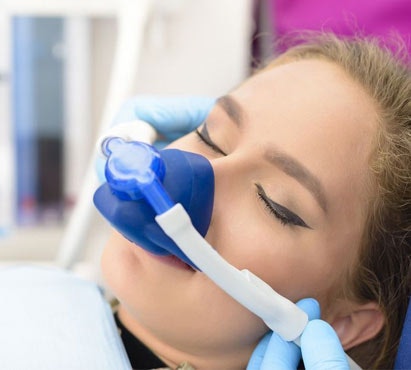 a sleeping woman wearing a nose mask