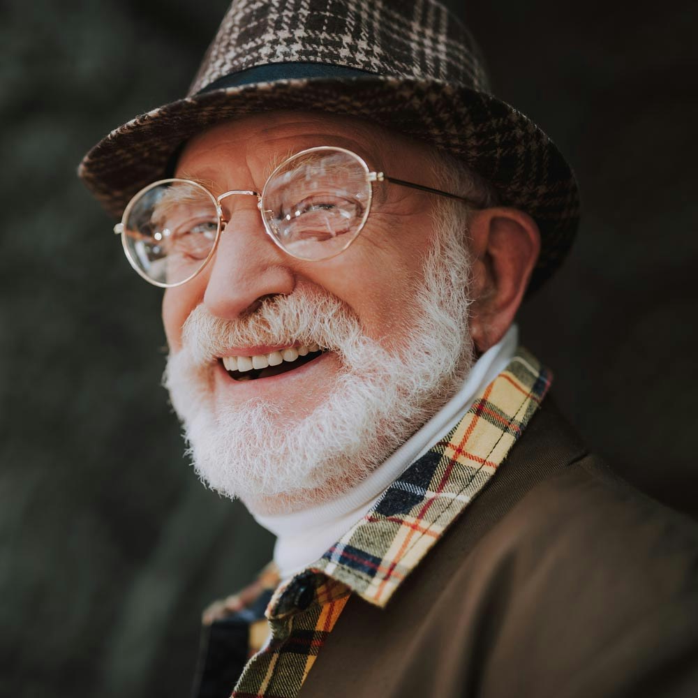 Mature older man smiling with dental bridge