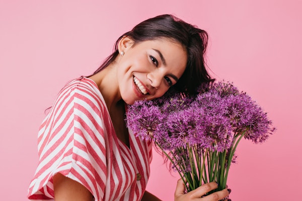 Smiling woman with dimples and flowers