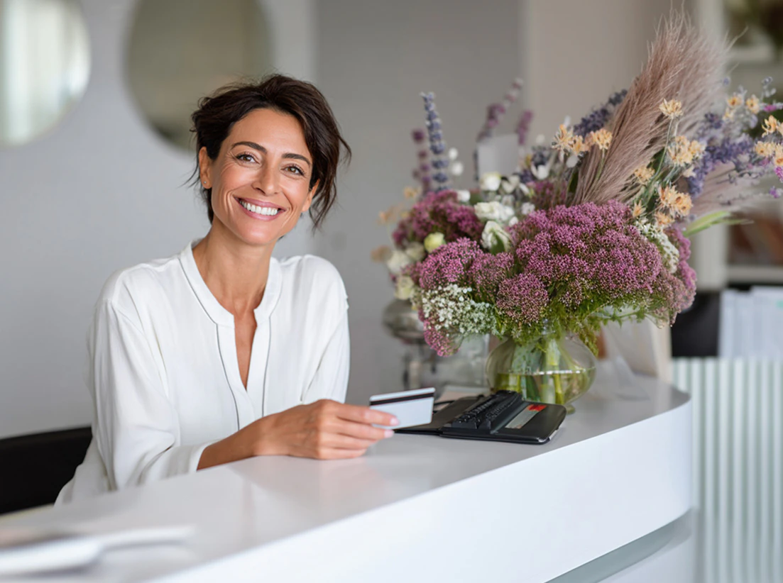 woman paying for a blepharoplasty