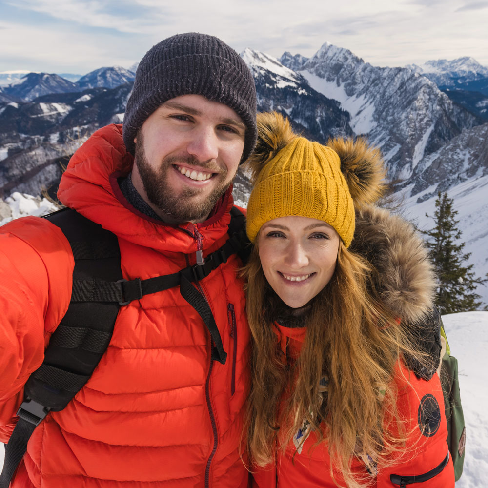 couple smiling in the mountains