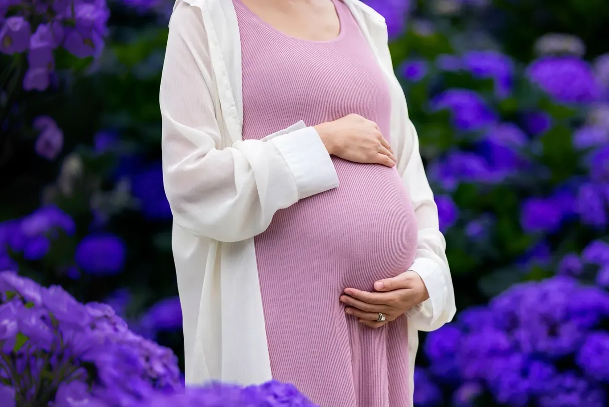 Pregnant woman holding her stomach