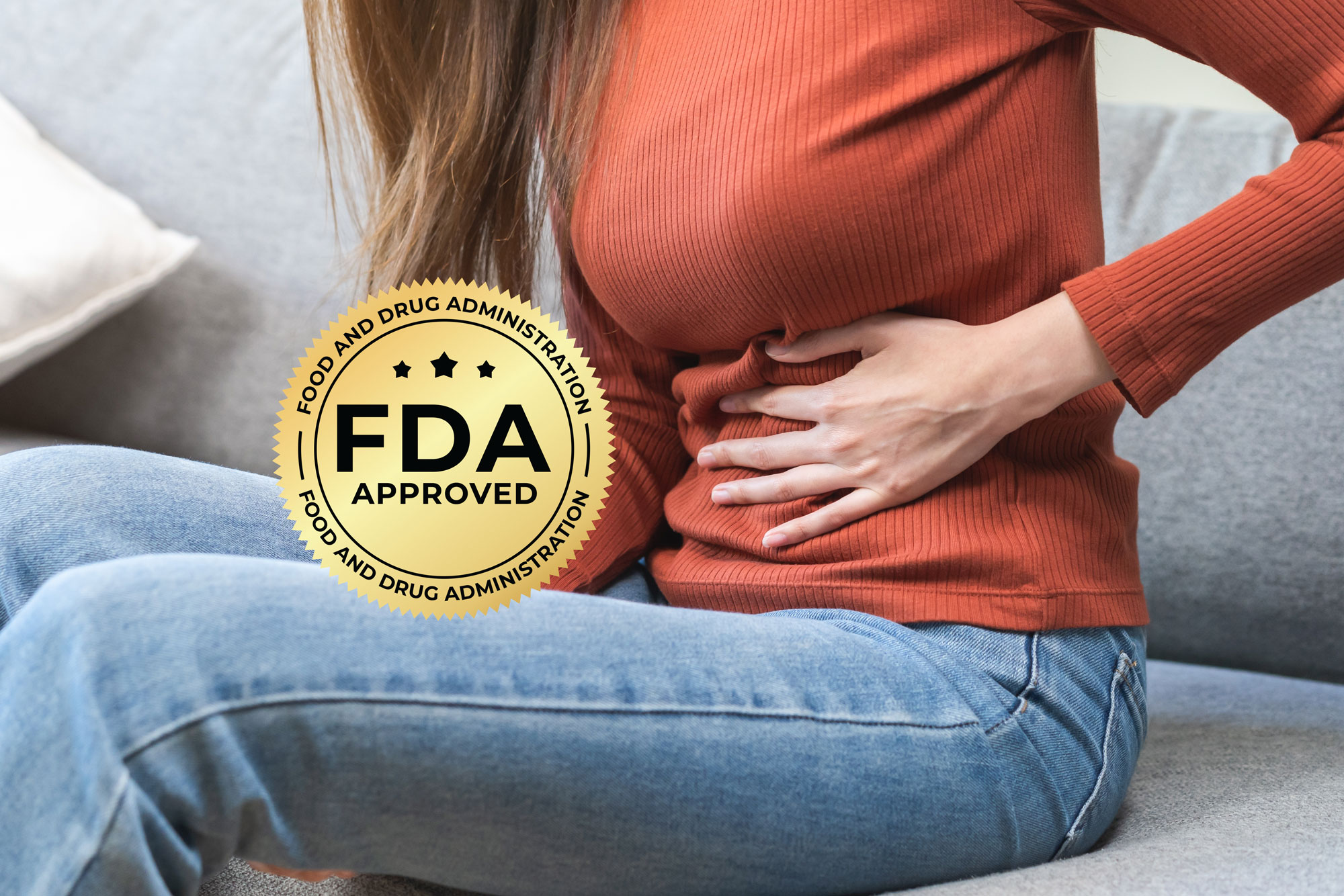 Woman touching abdomen and FDA seal