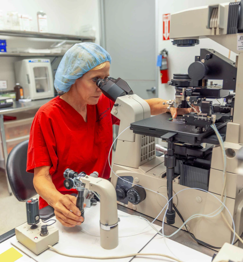 Dr. Sonja Kristiansen using a microscope