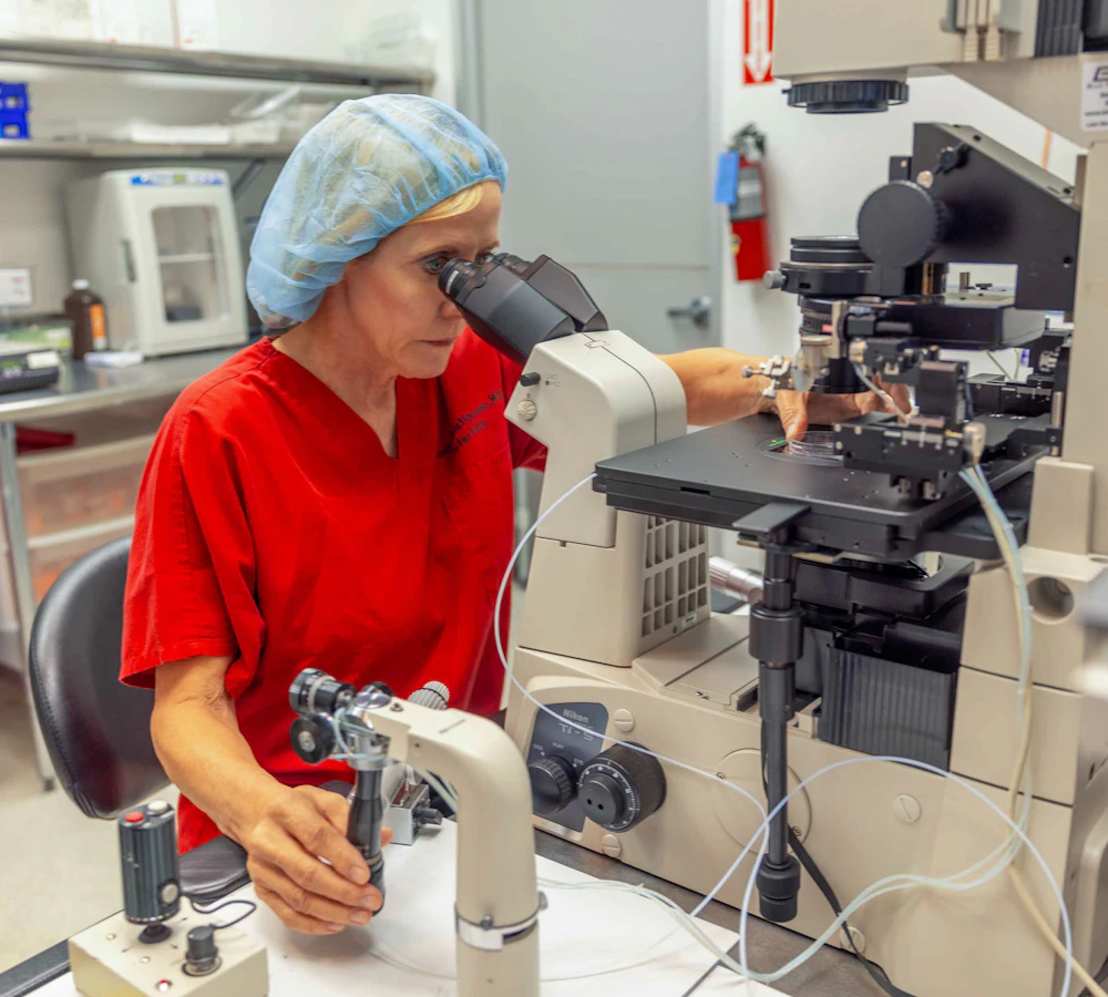 Dr. Sonja Kristiansen using a microscope