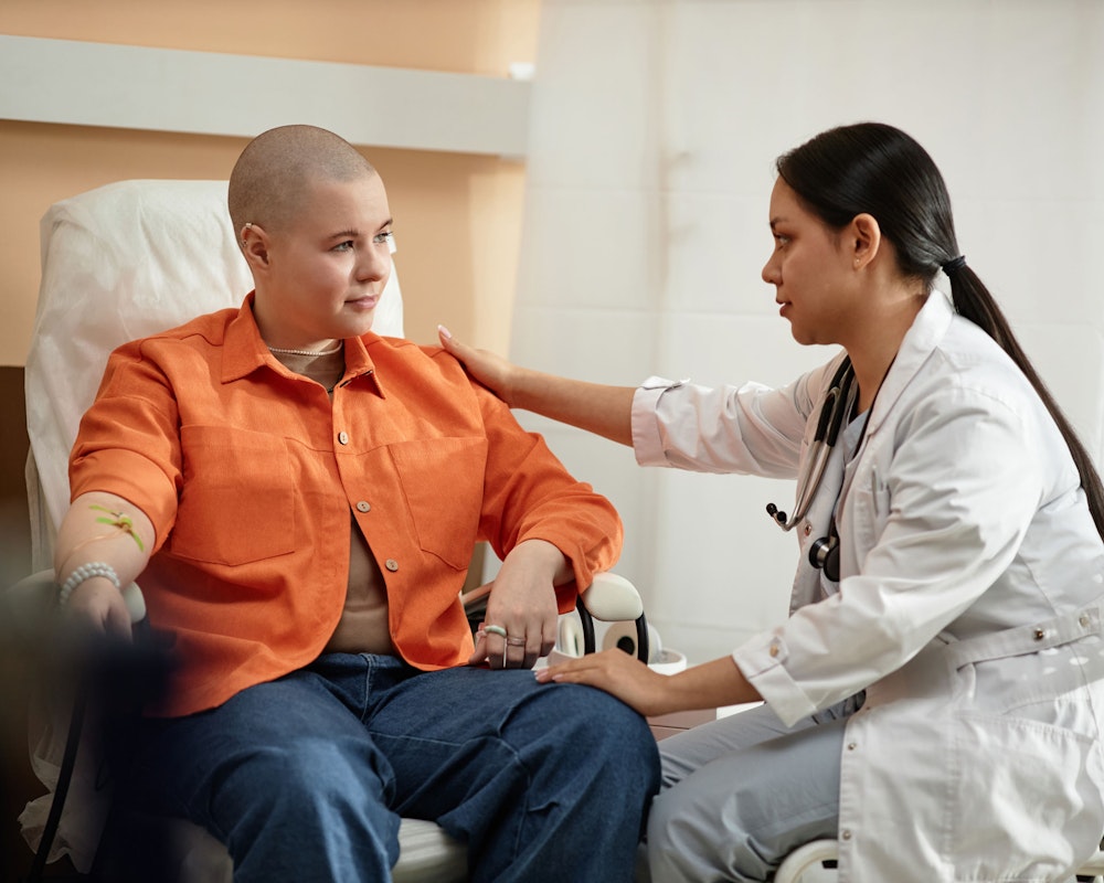 Patient with cancer speaking with doctor