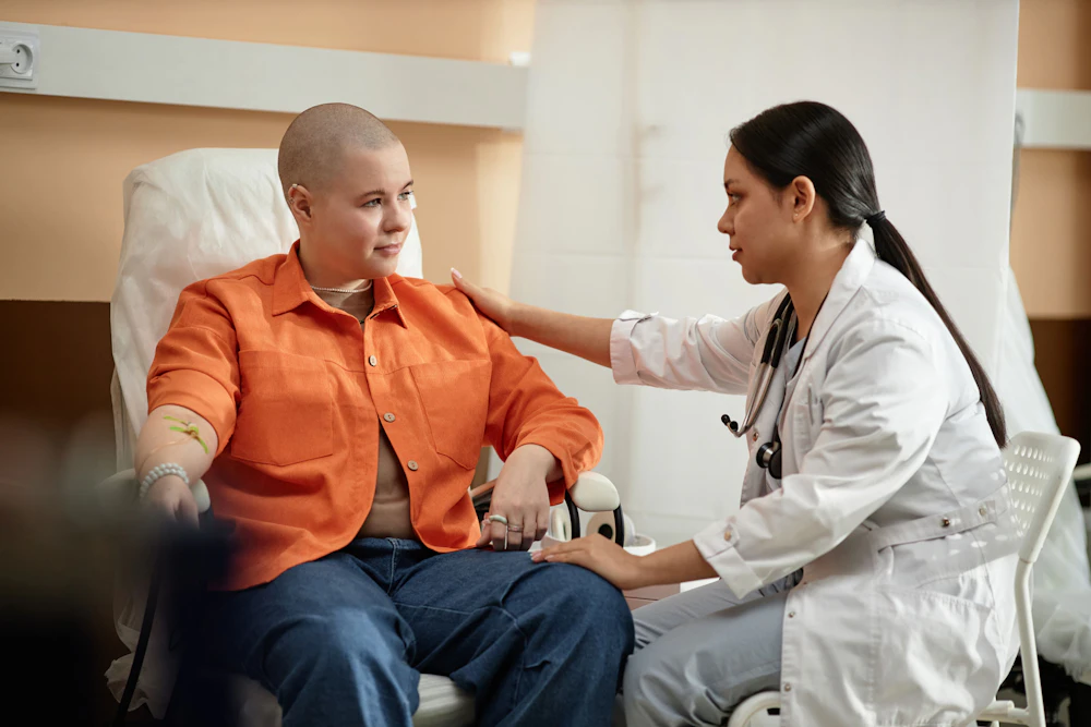 Patient with cancer speaking with doctor