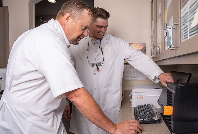 Woman with tooth pain at the dentist office