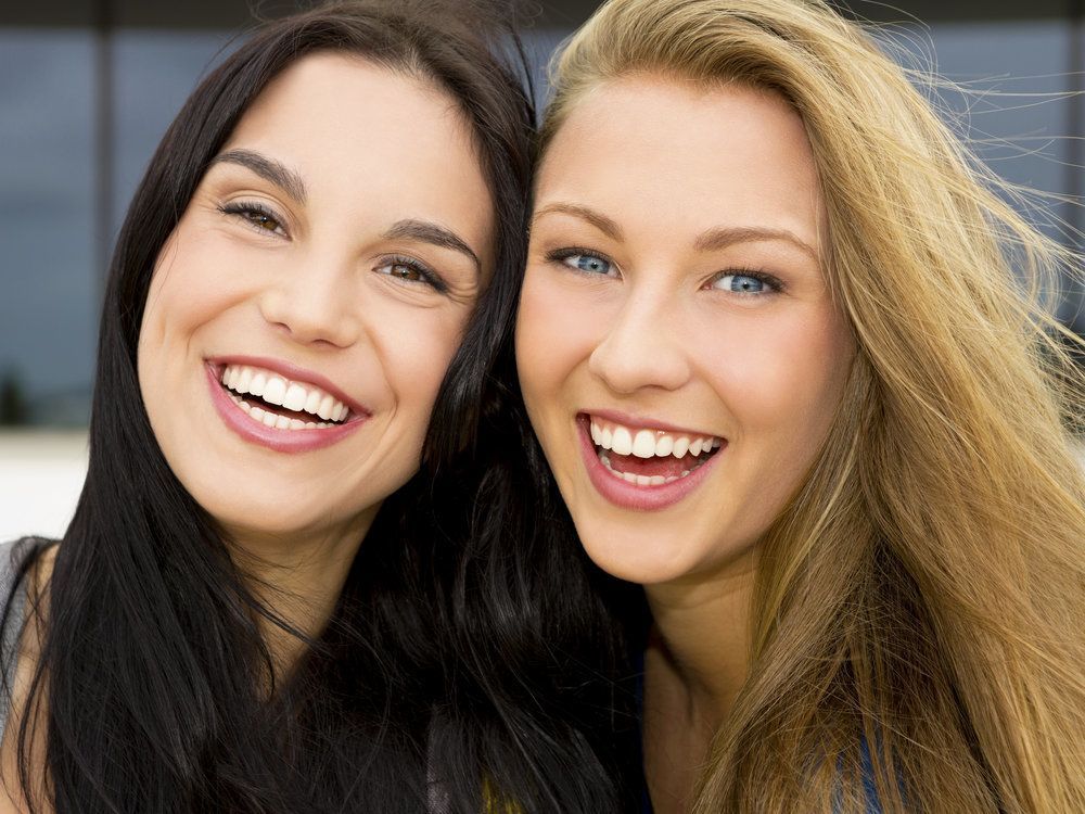 Two women with beautiful smiles
