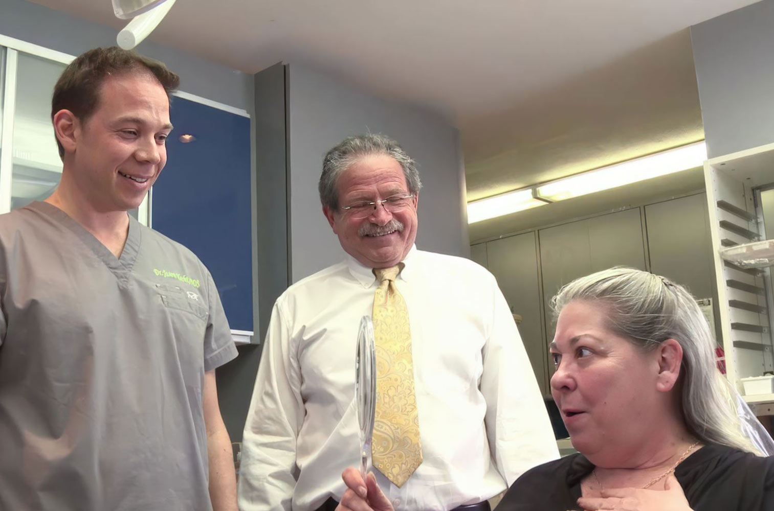 Dr. Jason Hecht and Alex Hecht with a patient