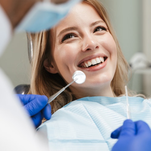 a smiling Staten Island woman at the dentist