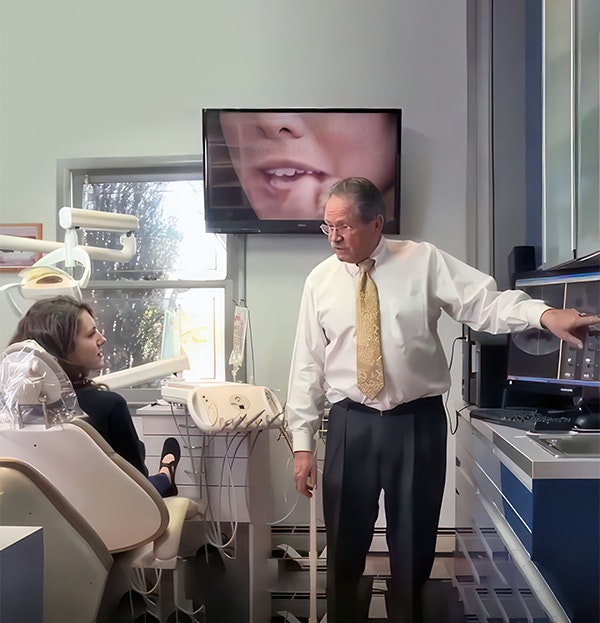 Dr. Alex Hecht discusses cosmetic dentistry treatment with a Staten Island patient