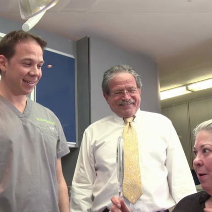 Dr. Jason Hecht and Dr. Alex Hecht with a patient
