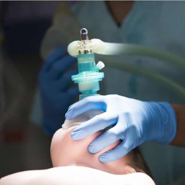 Anesthesiologist delivering anesthesia before surgery