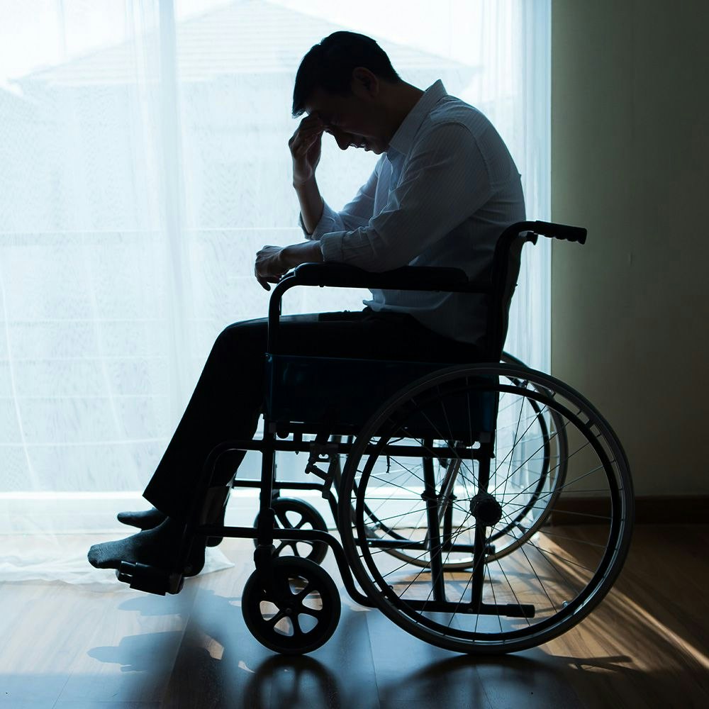 silhouette of a person in a wheelchair