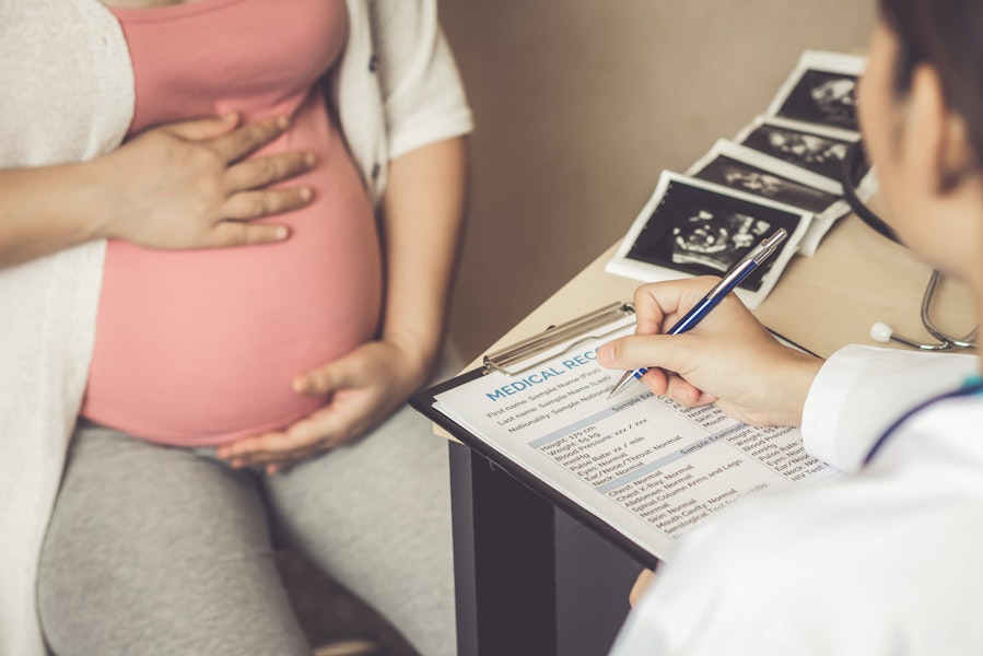 Pregnant woman meeting with doctor