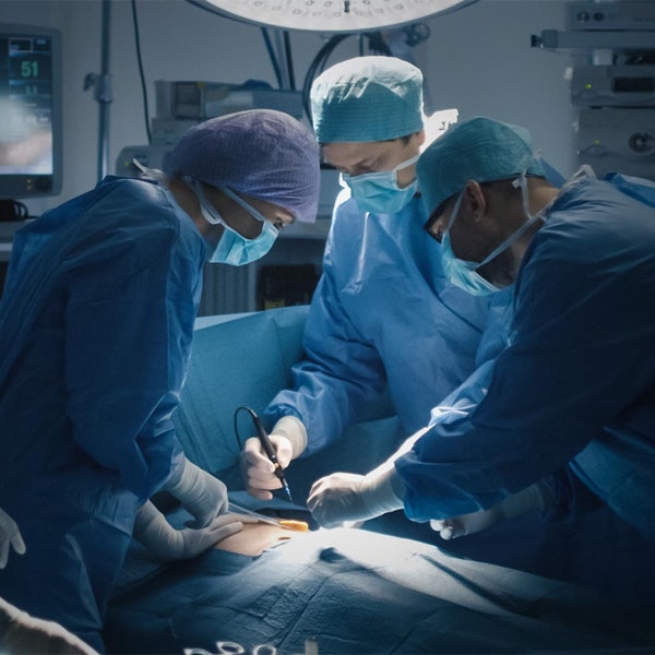 surgeons performing surgery