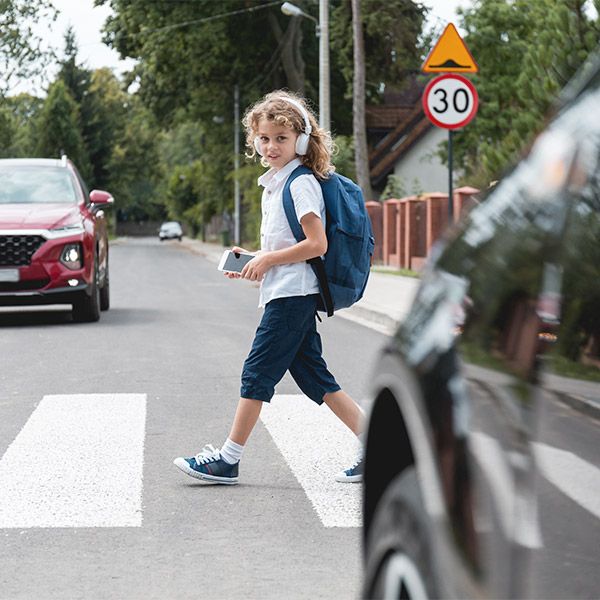 child walking in front of a car