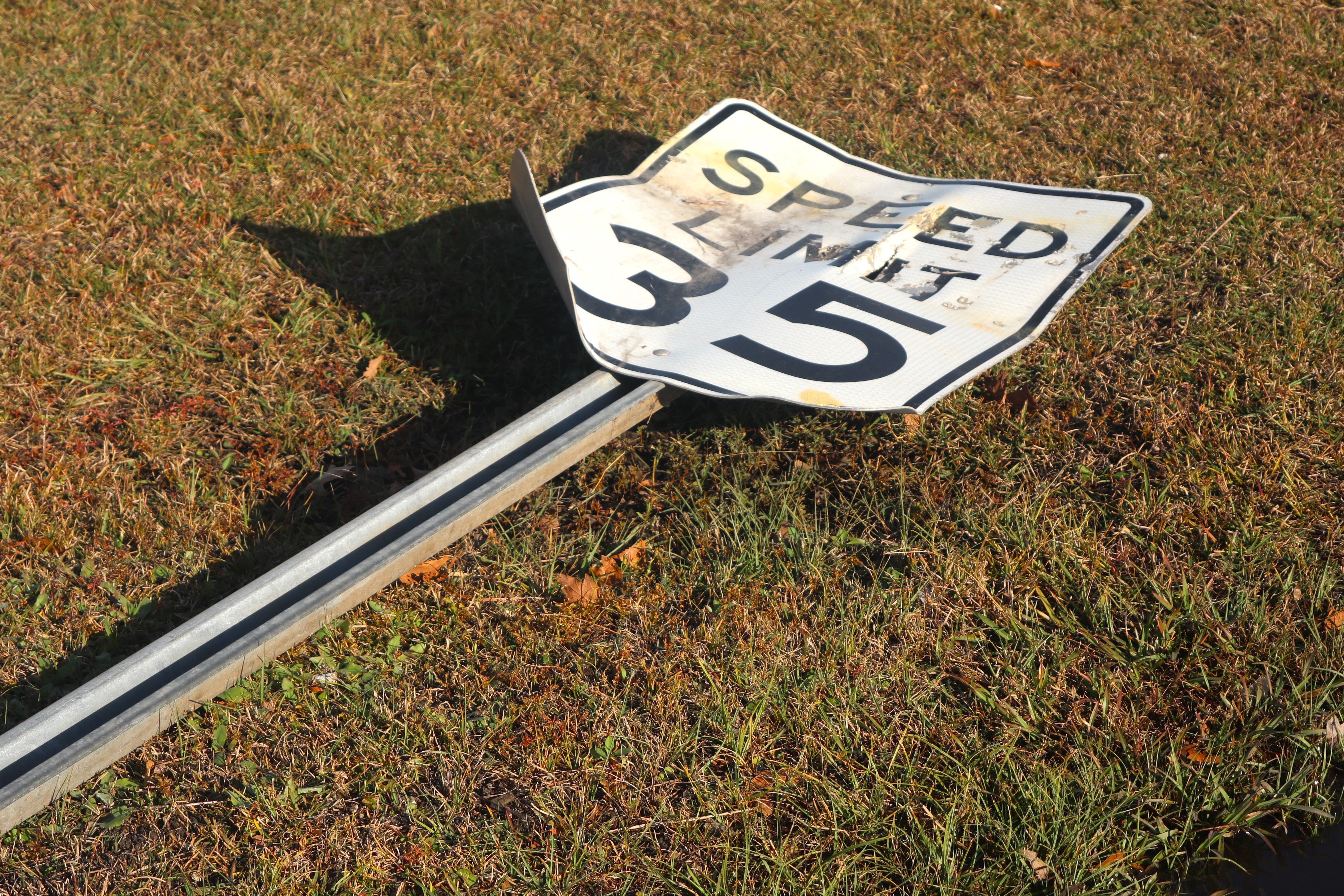 broken speed limit sign