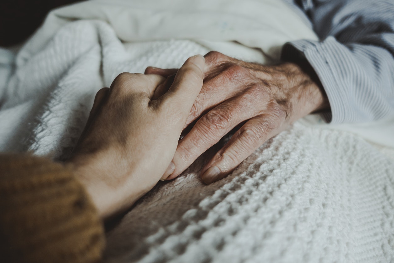 holding elderly loved one