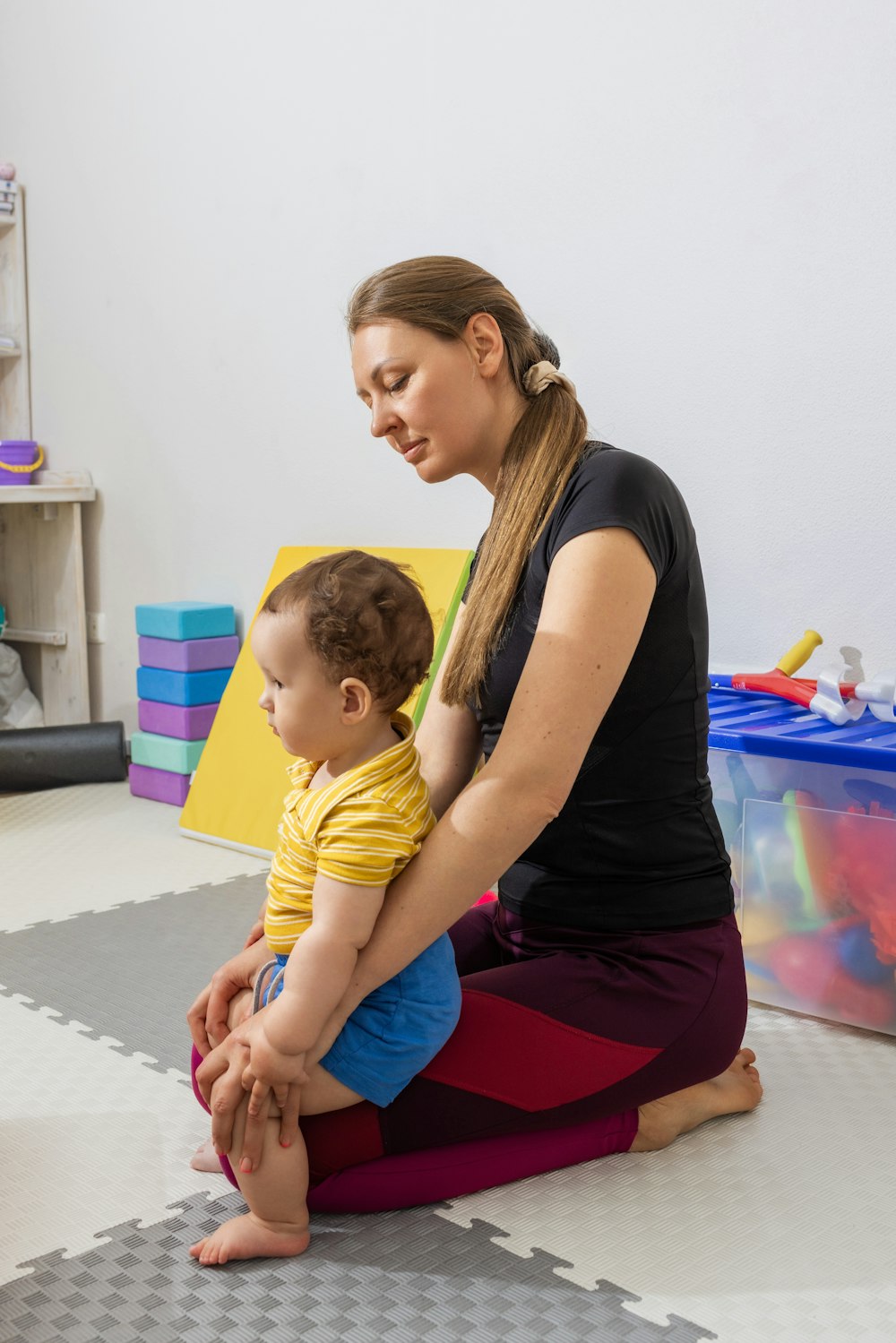 Mother with toddler son at a therapy appointment