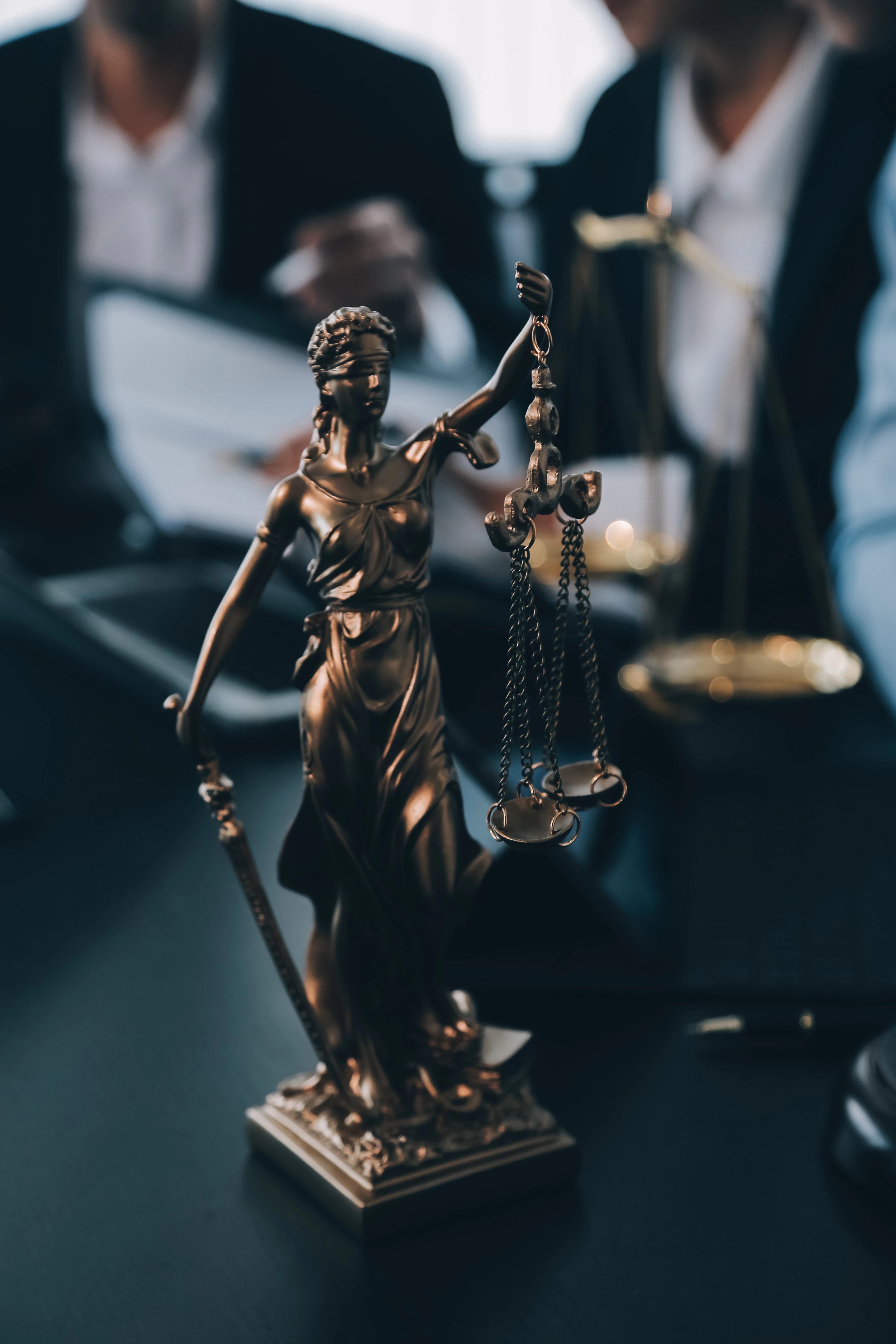 Close-up of a Lady Justice statue holding balanced scales