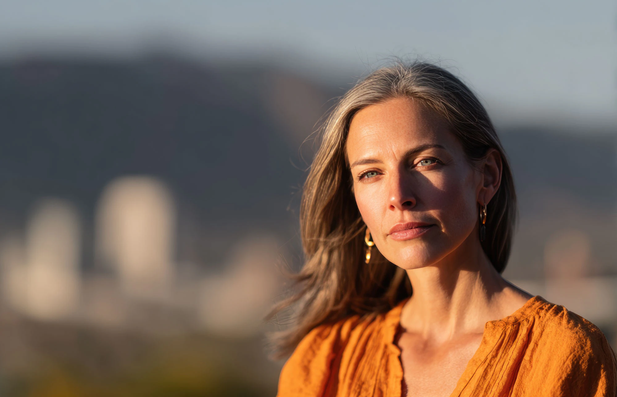 Woman with a serious expression looking into the distance