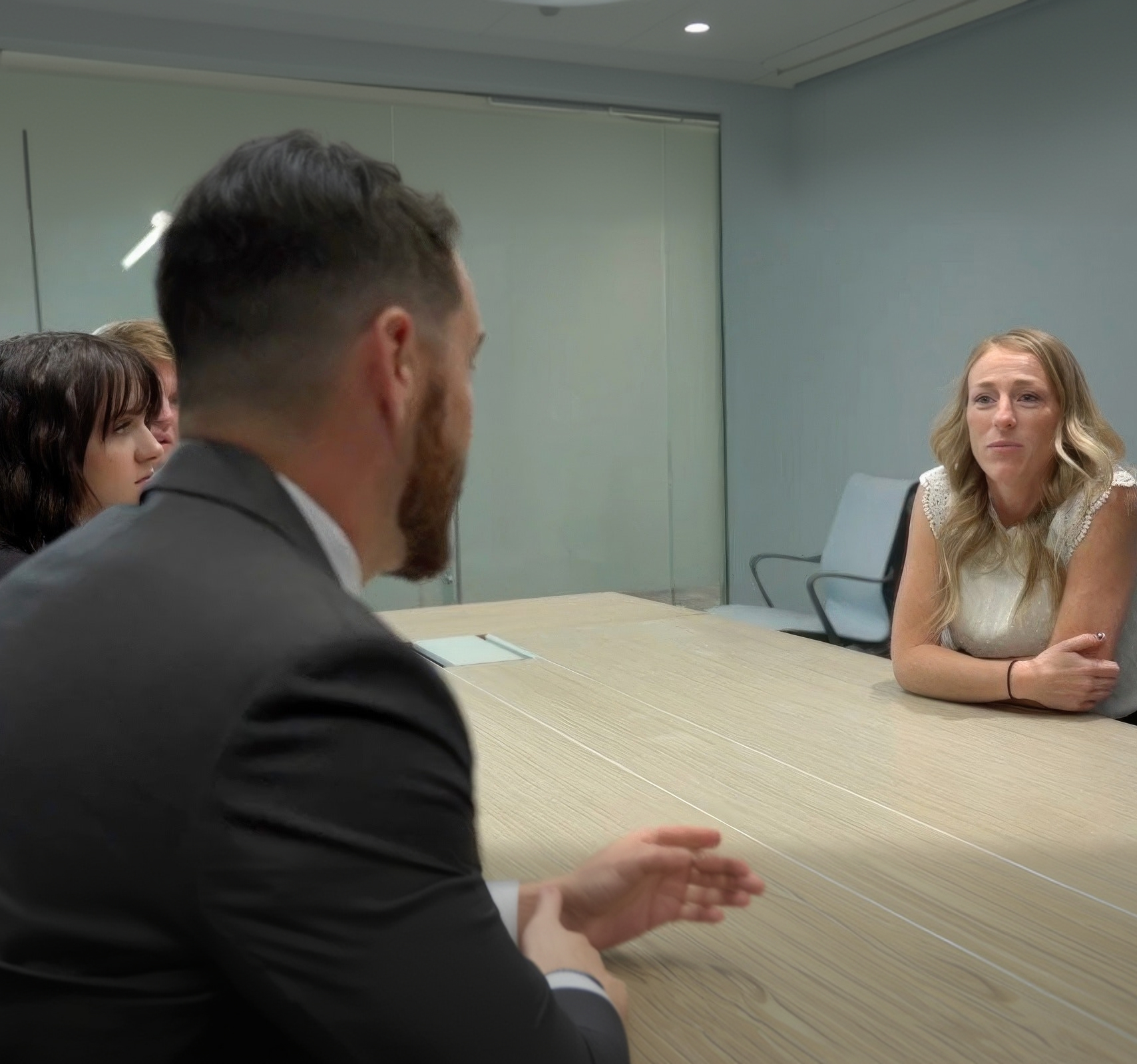 Attorney and staff meeting with client