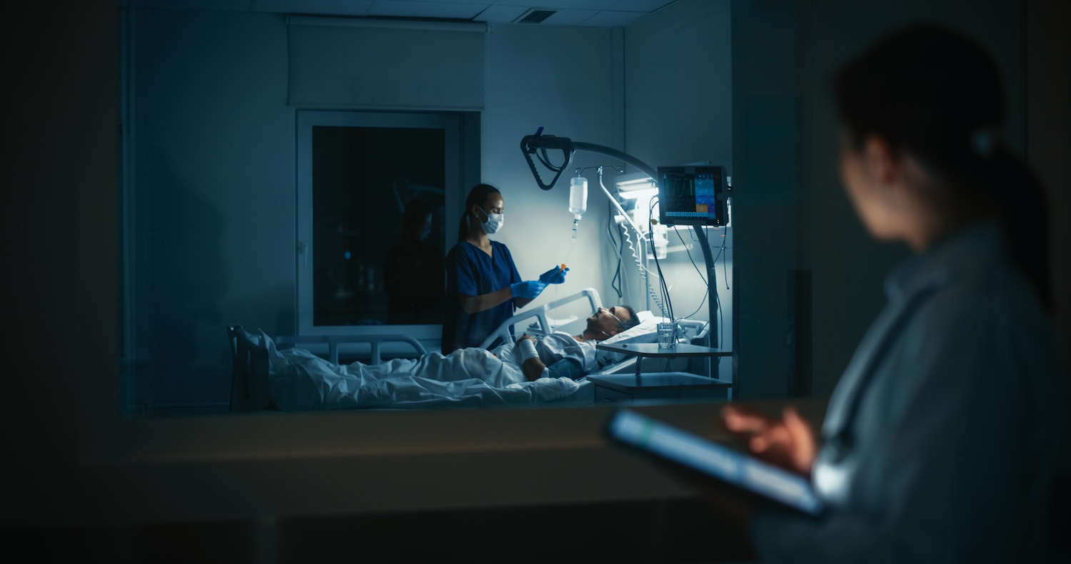 Sick man in hospital bed