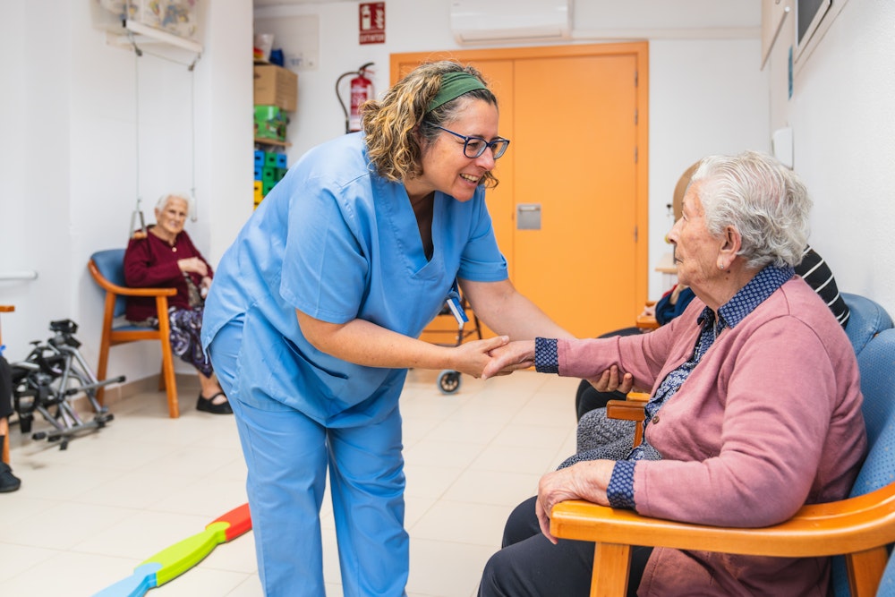 caregiver holding senior