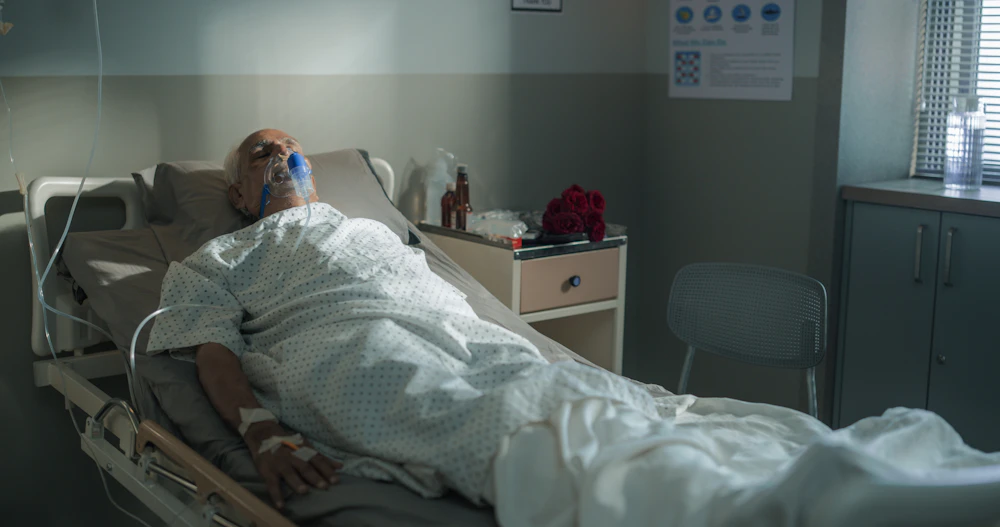 senior in a hospital bed