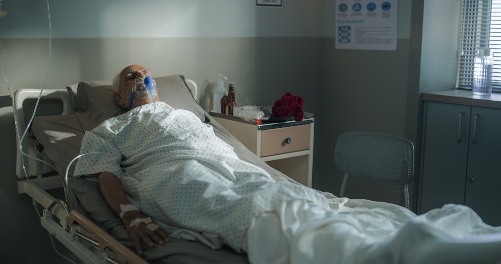 senior in a hospital bed