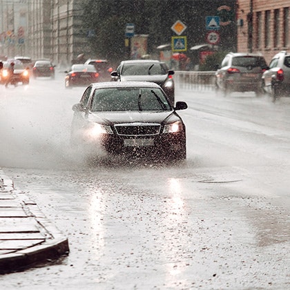 Car driving in the rain