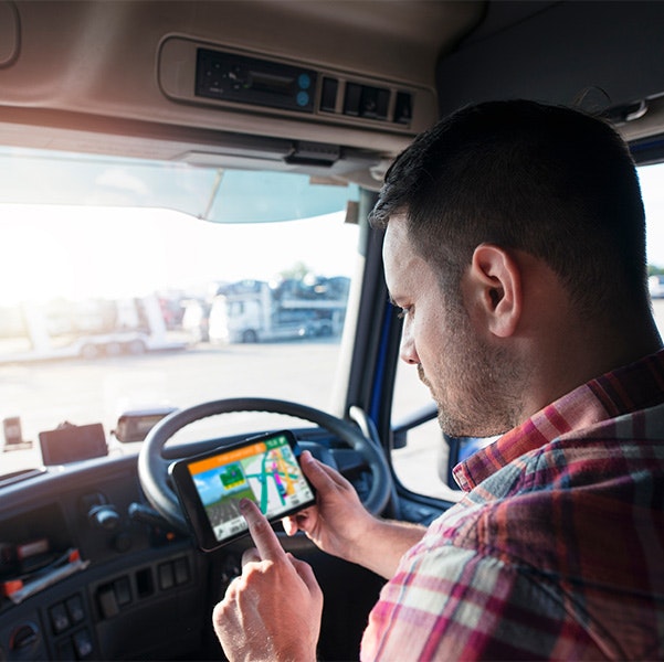 Truck driver checking GPS