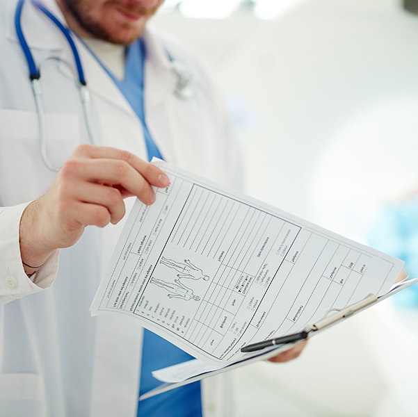 Doctor going over medical records with patient