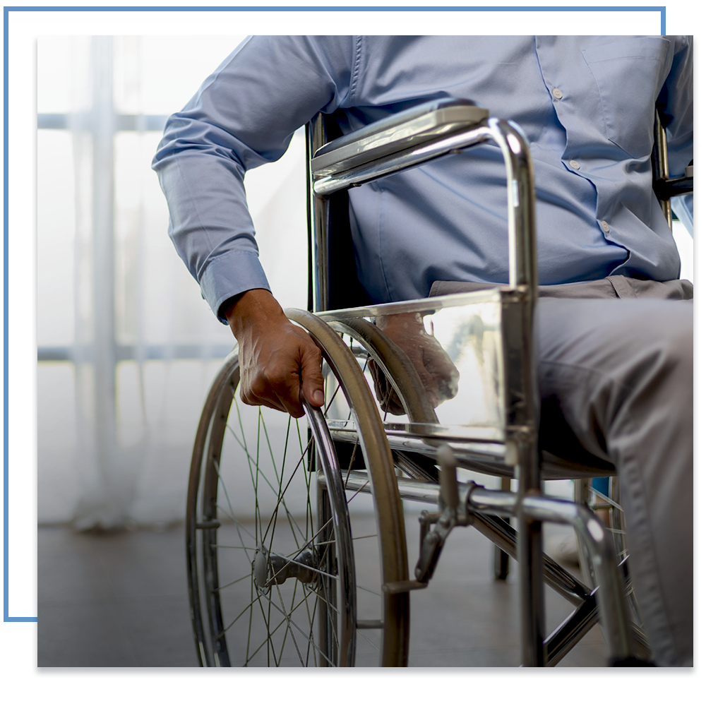 Woman in wheelchair looking at paperwork