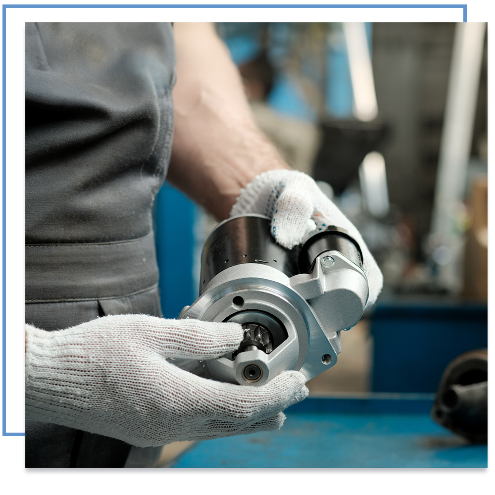 Man holding a car part