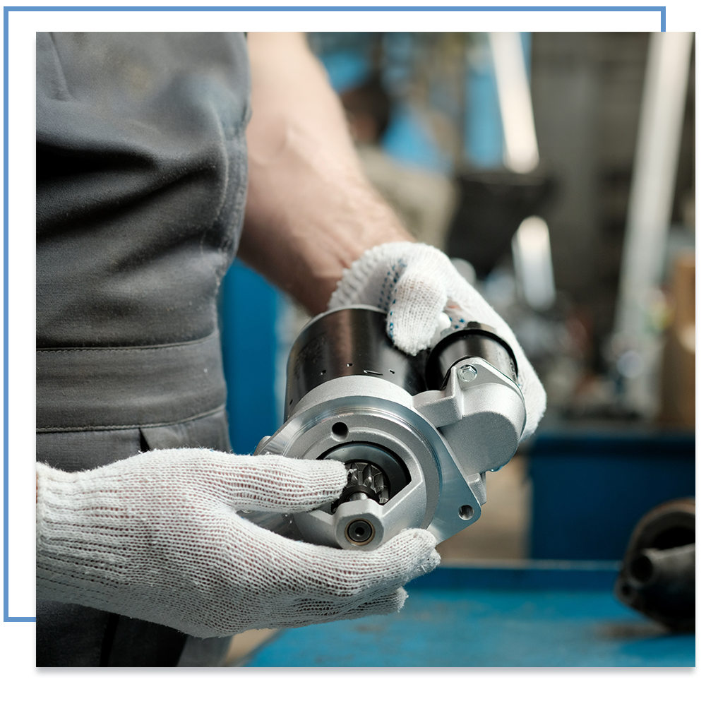 Man holding a car part