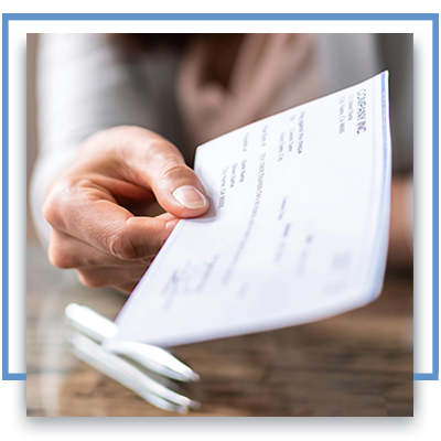 Person handing another a check