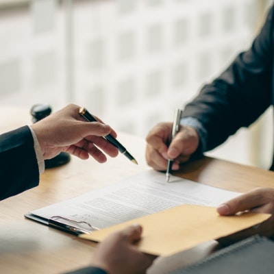 lawyer and client filling out paperwork